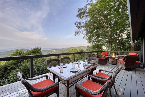 Plenty of seating on the deck to soak in the views.  Cushions are all stored in closed containers so they will be dry and ready for use!