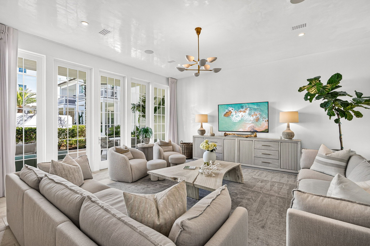 Tons of natural light filters in through the large doors and windows in the living room.