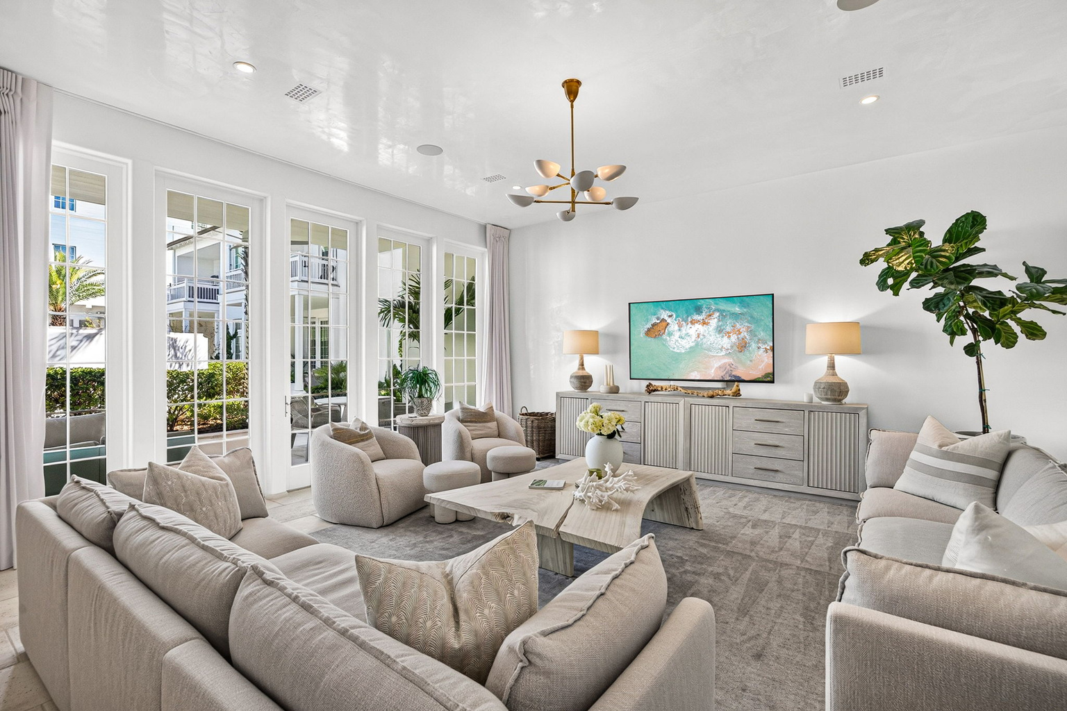Tons of natural light filters in through the large doors and windows in the living room.