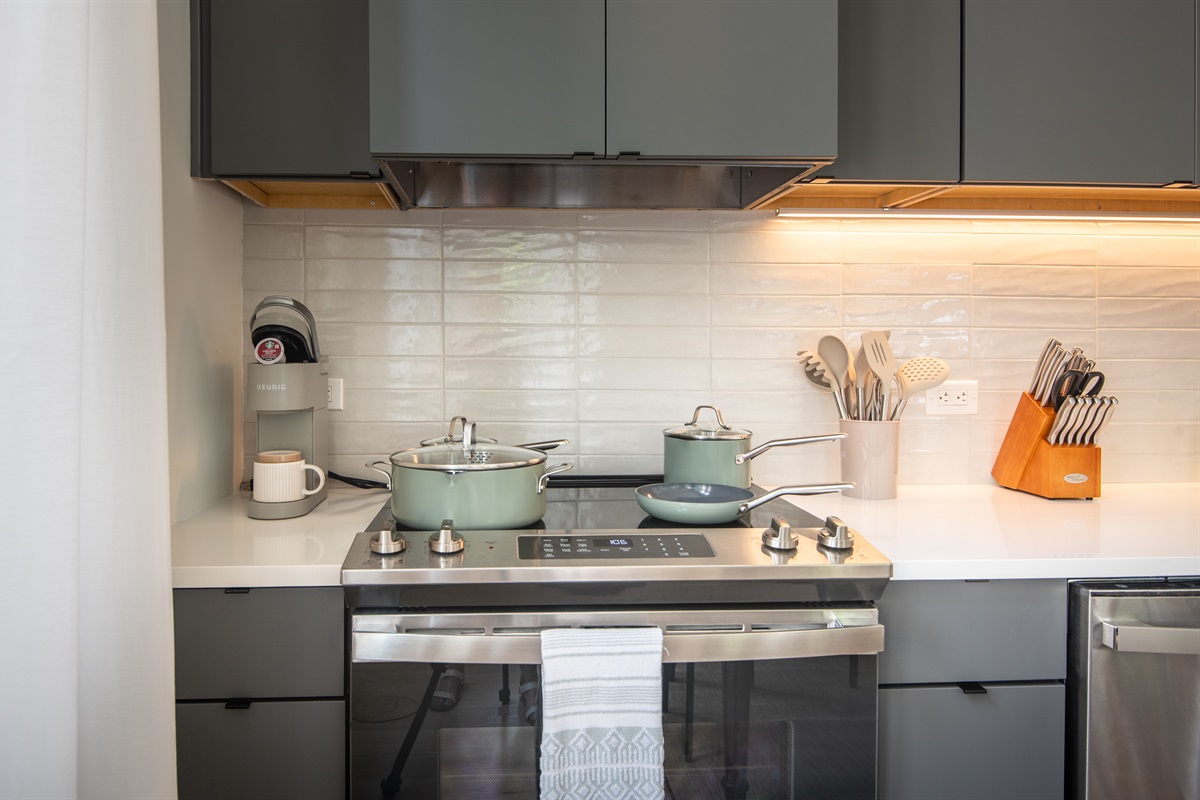 Fully equipped kitchen with stove, cookware, and essentials