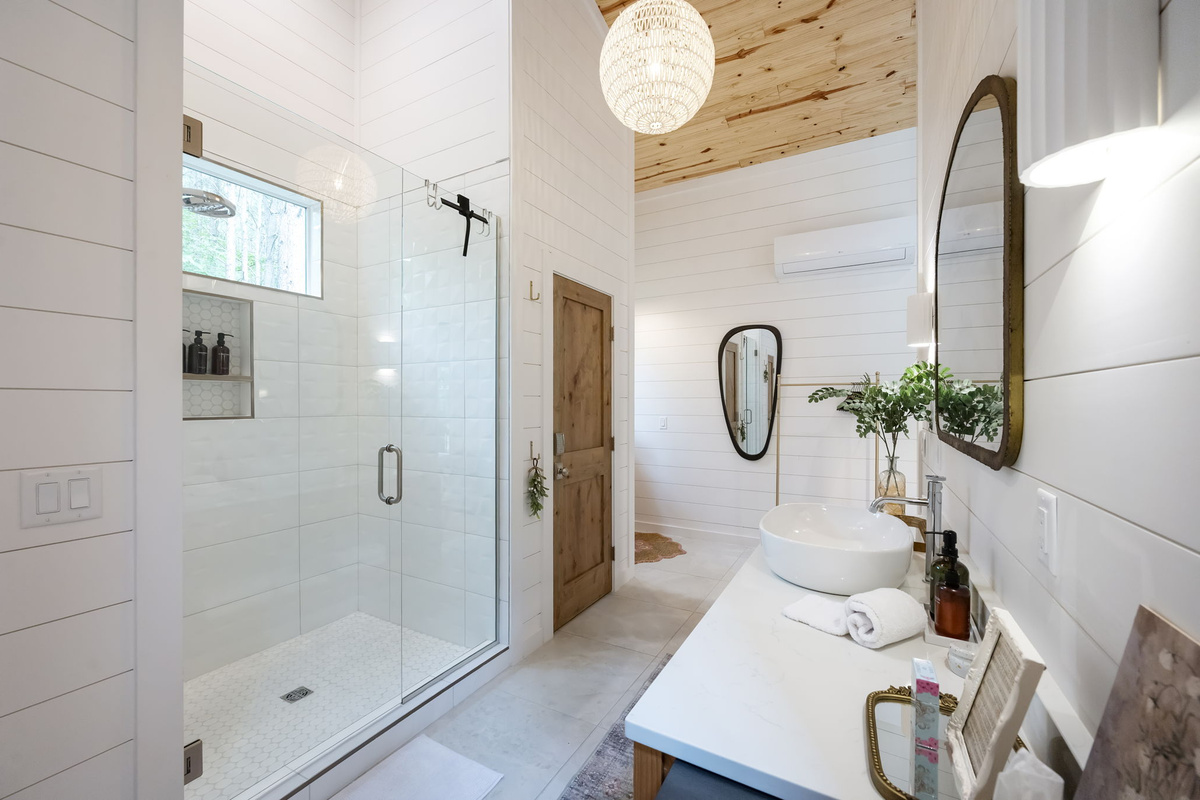 The private casita ensuite bathroom offers a luxurious, spa-like experience with premium finishes, warm design touches, and complete privacy—creating the perfect place to relax and recharge.