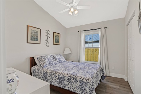 Bedroom 2 has a queen size bed, ceiling fan, and a closet for your items.