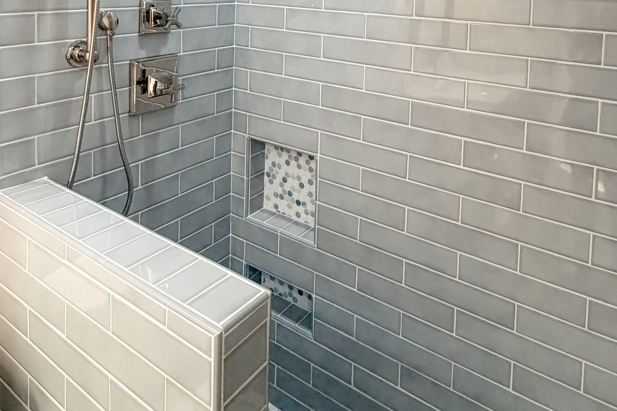 Modern walk-in shower with stylish tilework and elegant finishes.
