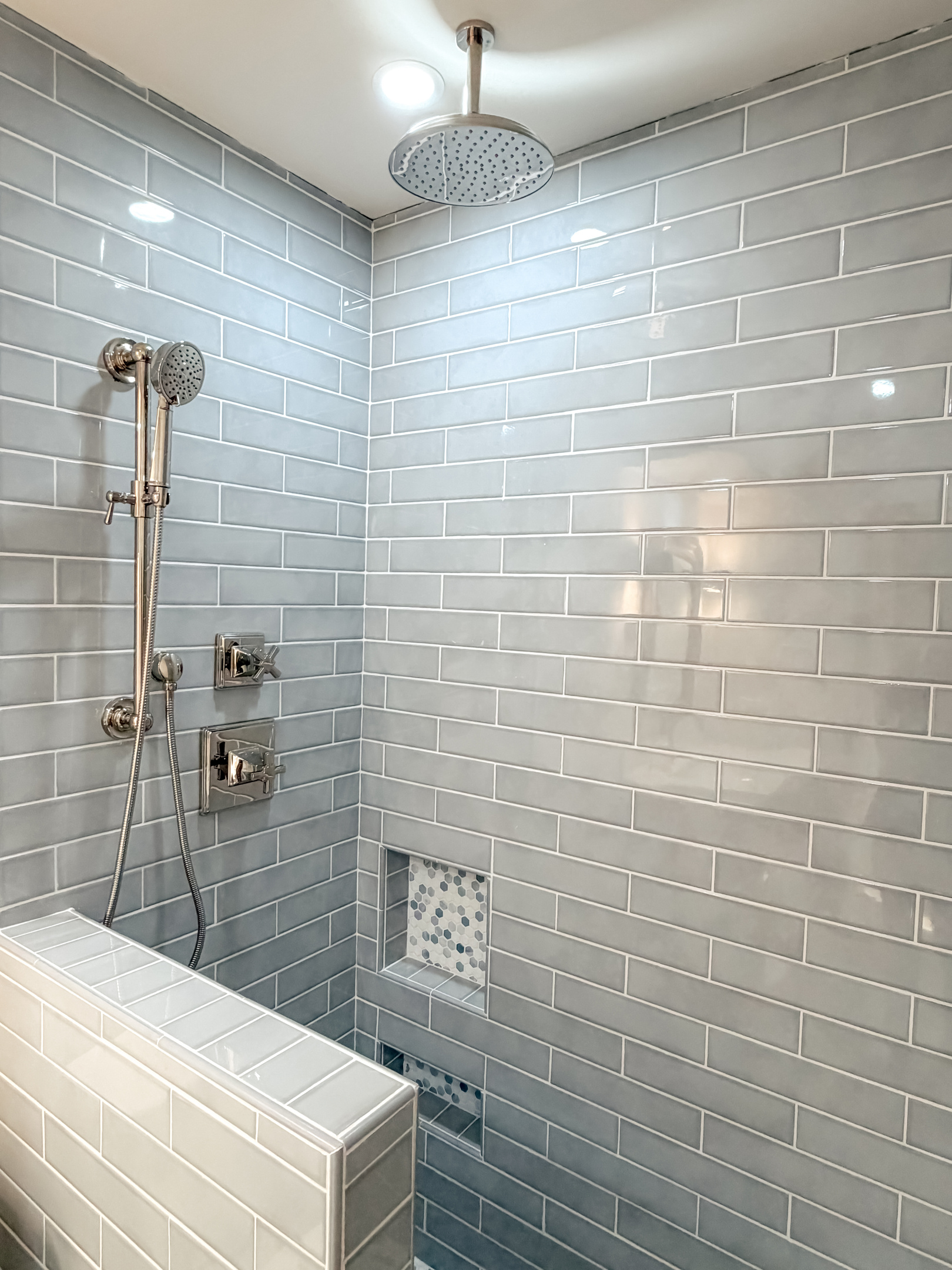 Modern walk-in shower with stylish tilework and elegant finishes.