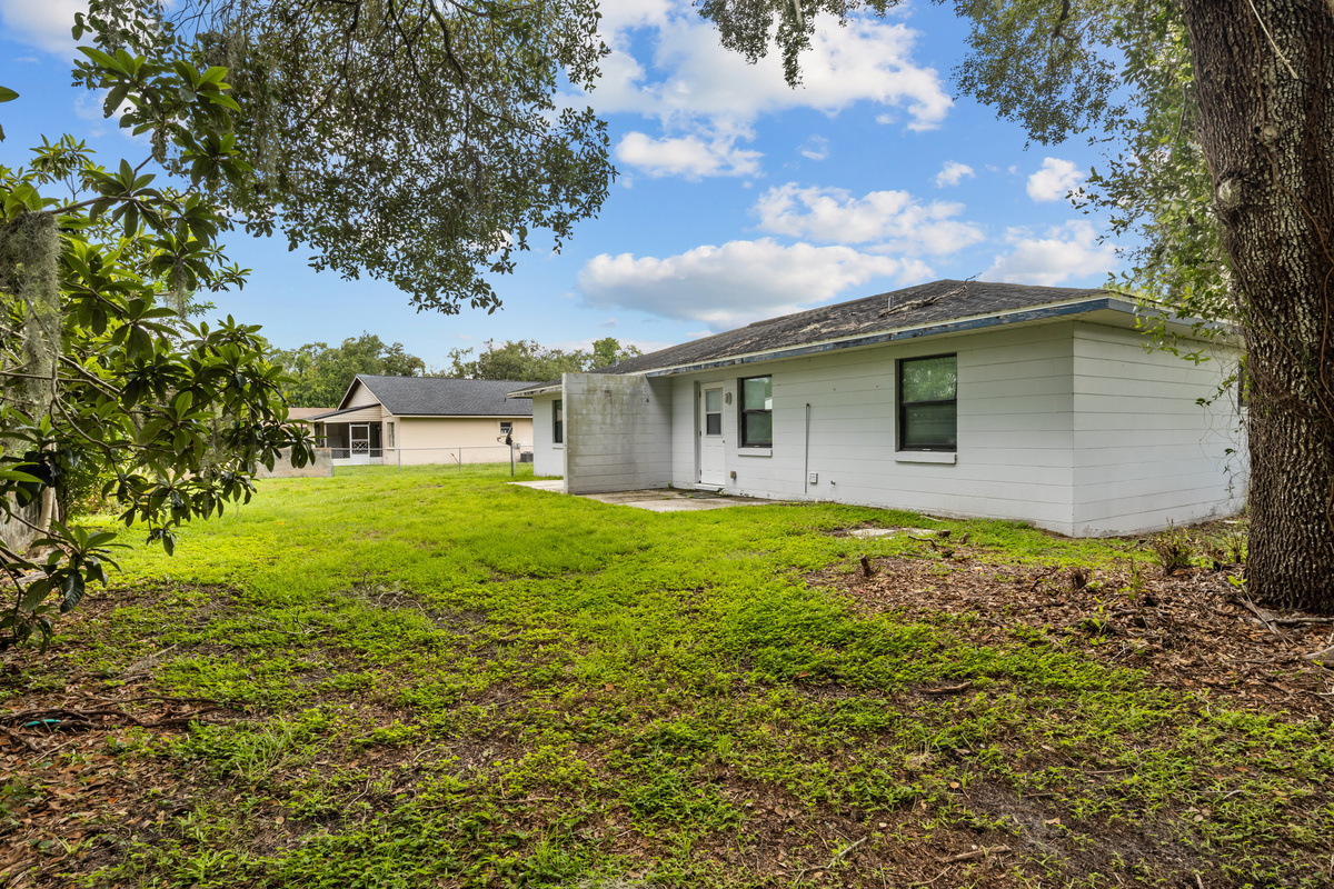 Unit #1 Left: Concrete wall separates patio from separate duplex unit patio.