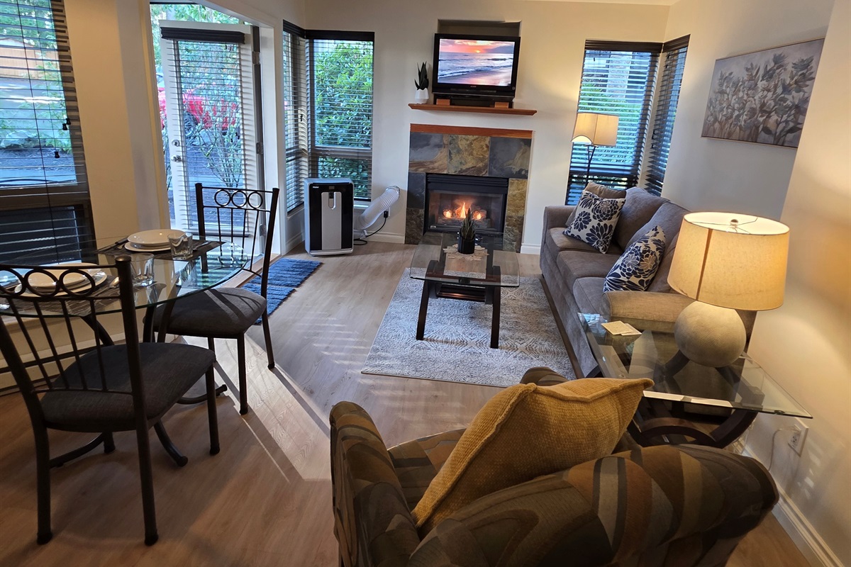 Unit B. Main Floor. Streaming TV. Double glass doors. AC unit / natural gas fireplace. Covered Patio. Open concept. Roomy and spacious. Queen pull out sofa for extra Guests.