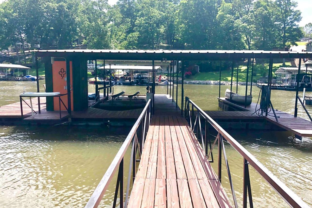 Two boat slips, one with 6000# lift for Vhaul boat and other open, fish cleaning station, table and chairs, plus more!