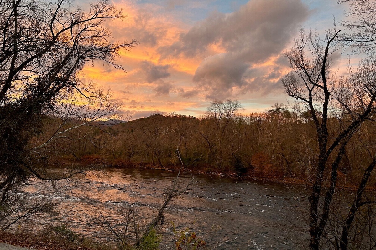 The sunrise over the river create amazing colors that are reflected on the water
