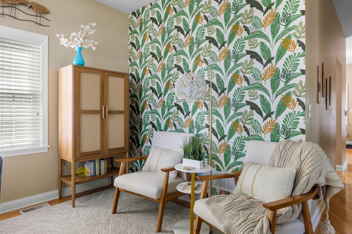 The bold colors in the den are inviting, yet calming at the same time. This room has a cabinet full of games, and books to suit kids or adults. 