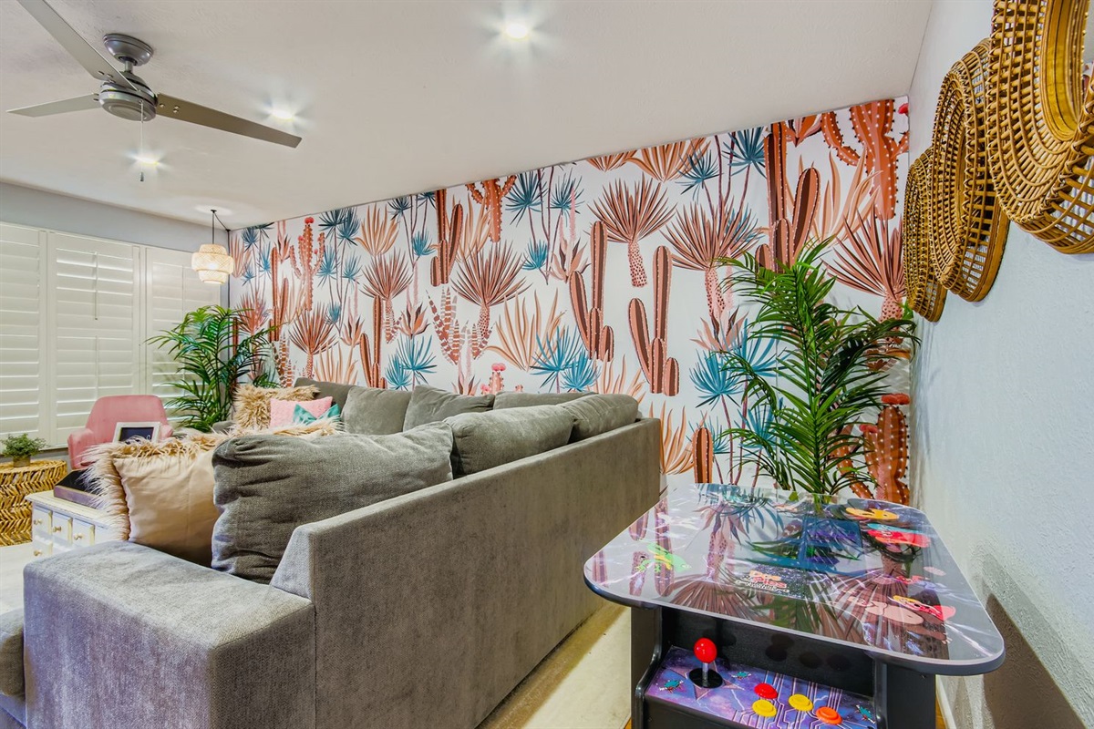 Relax In The Living Room With A Comfy Couch And Arcade Games