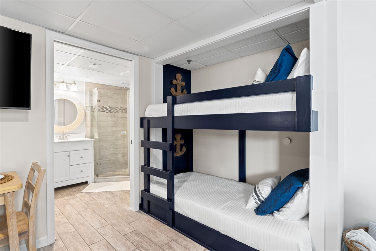 Twin bunk beds with reading nook lights. 