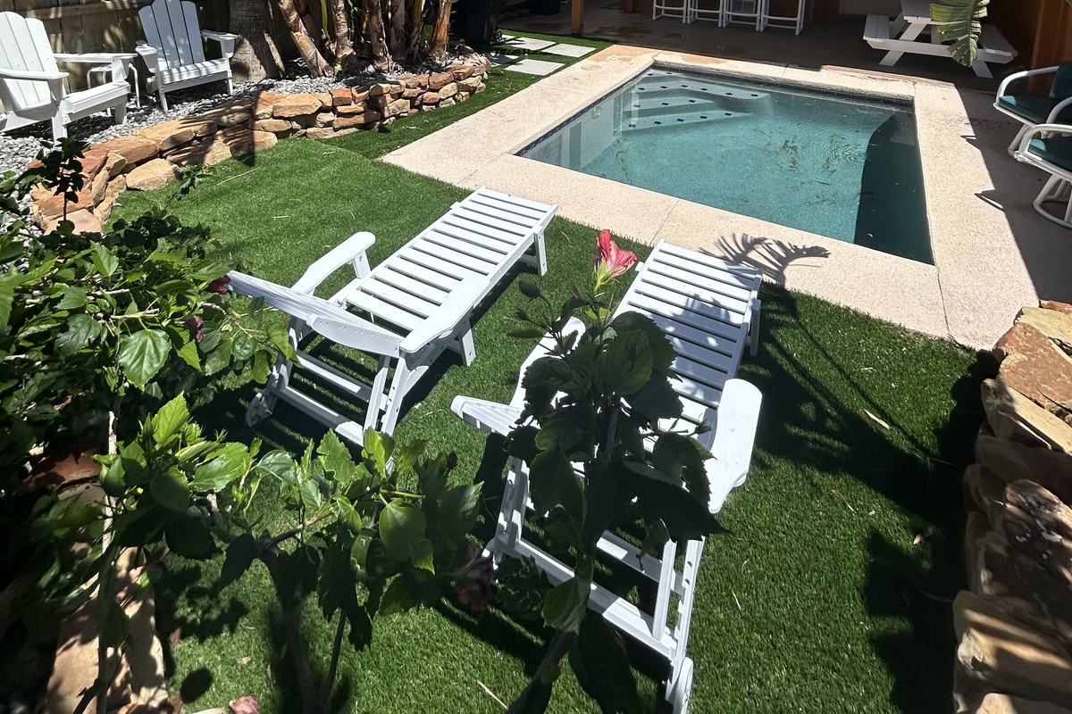 Enjoy a cool dip in the plunge pool in this relaxing backyard oasis.