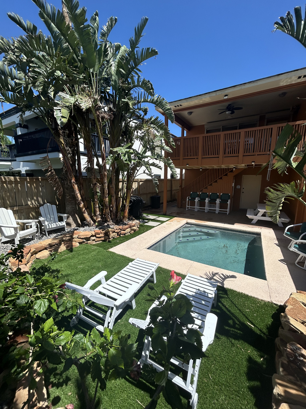 Enjoy a cool dip in the plunge pool in this relaxing backyard oasis.