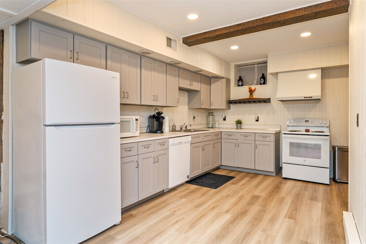 Whip up meals with ease in the spacious, full basement kitchen featuring modern appliances and plenty of counter space.