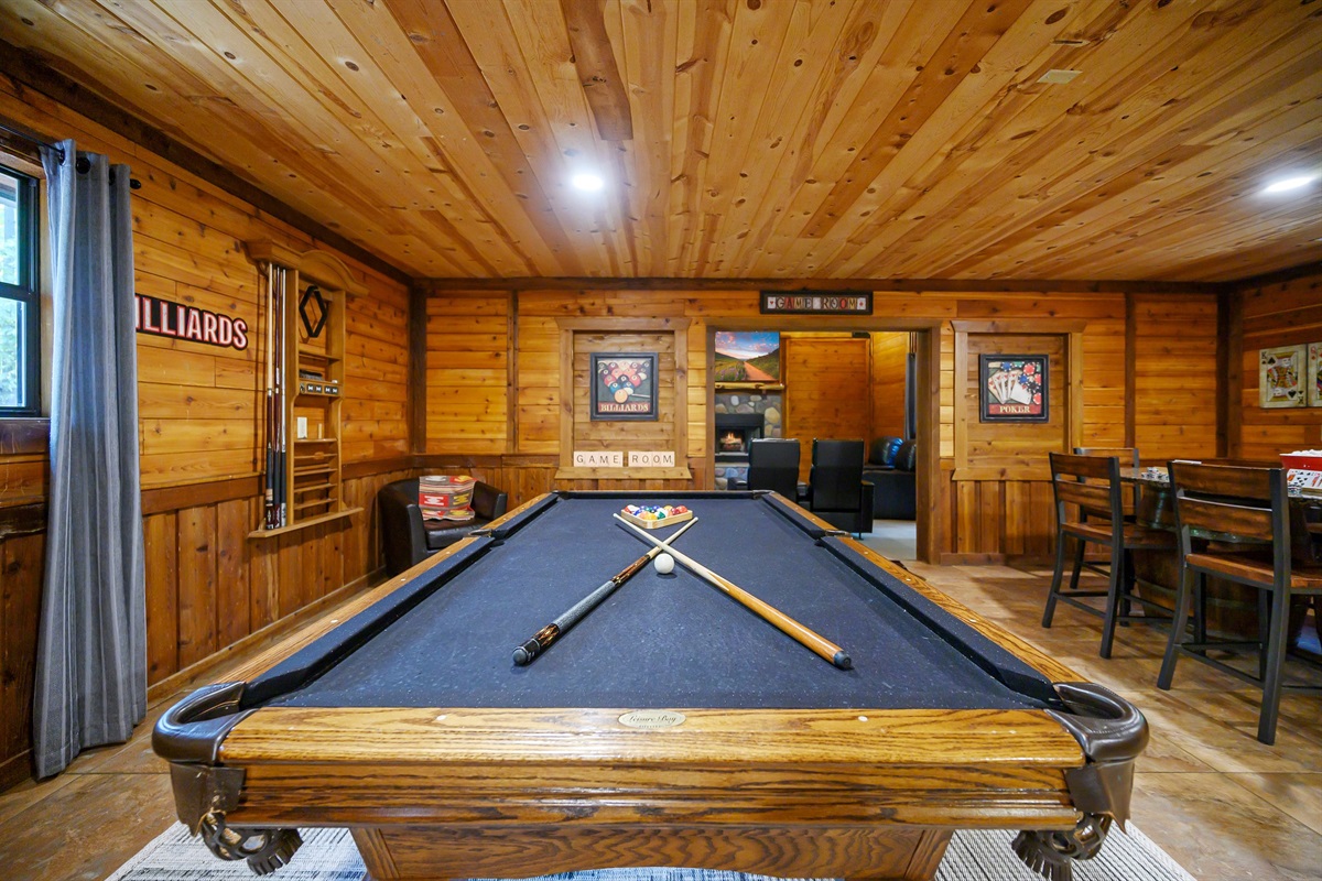The game room leads to the media room for the perfect entertainment set up. Game room located downstairs from bedrooms 4 & 5. Access to game room from 2nd entry door as well.