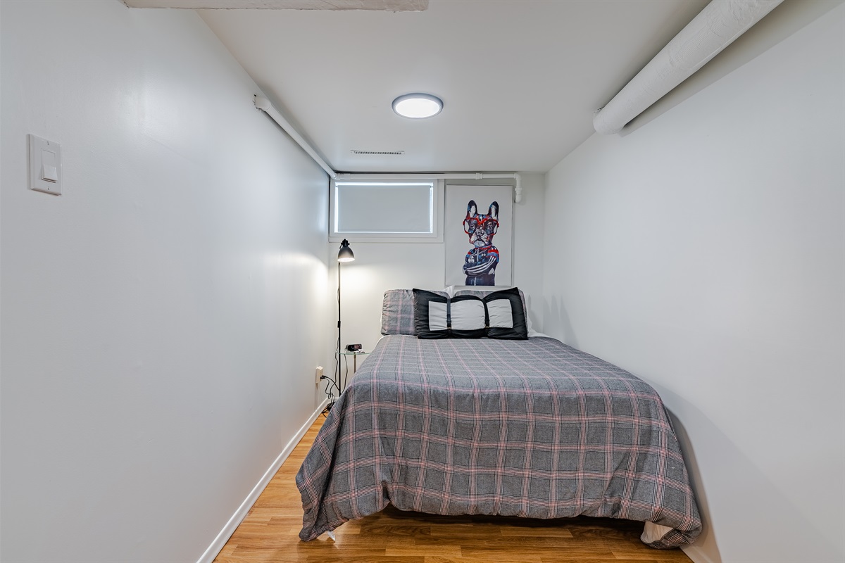 Cozy bedroom with a comfortable double (full 54" wide) bed. As with many 1940s homes, ceiling height is lower in some areas.
