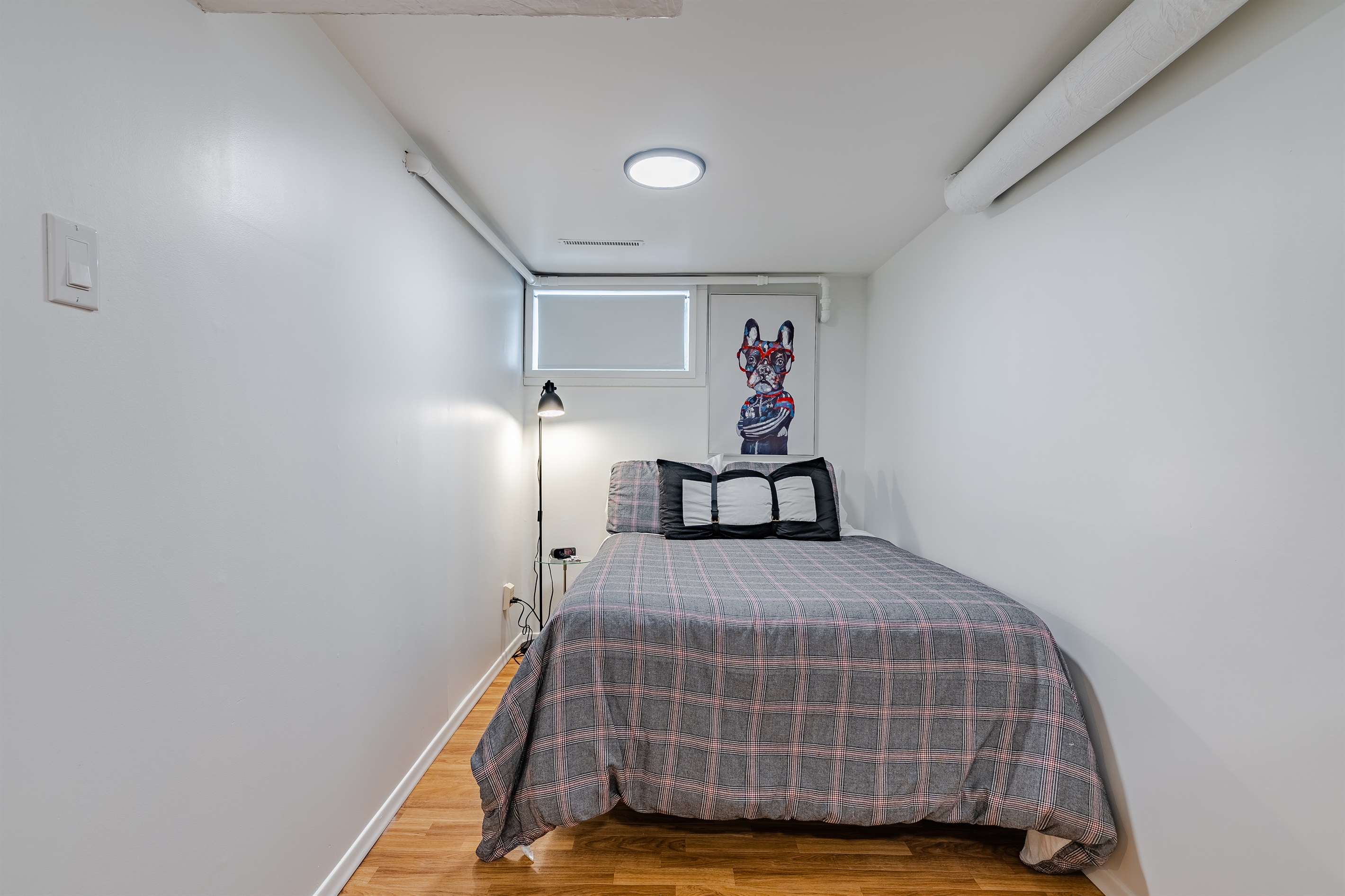 Cozy bedroom with a comfortable double (full 54" wide) bed. As with many 1940s homes, ceiling height is lower in some areas.