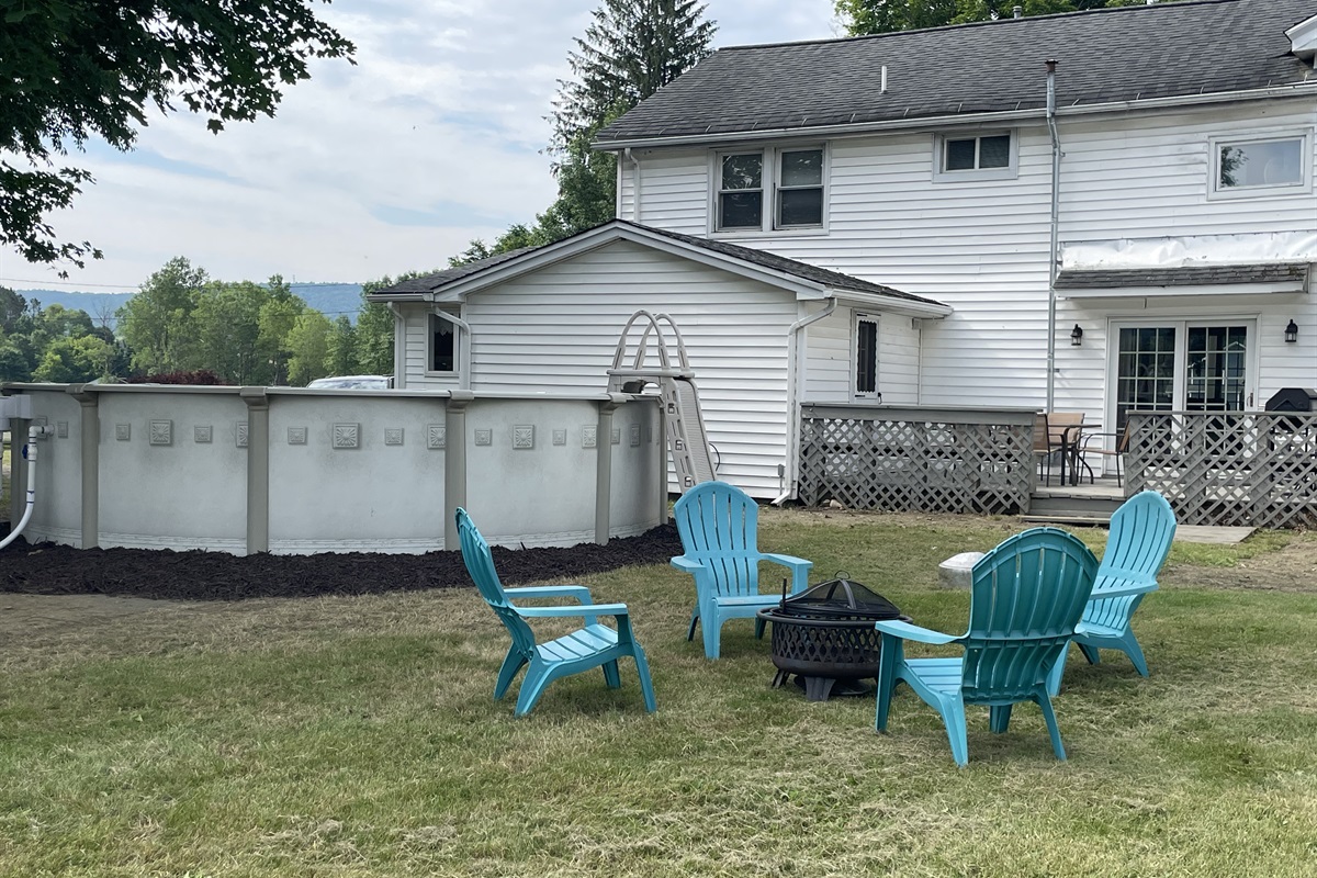 Firepit and pool in backyard