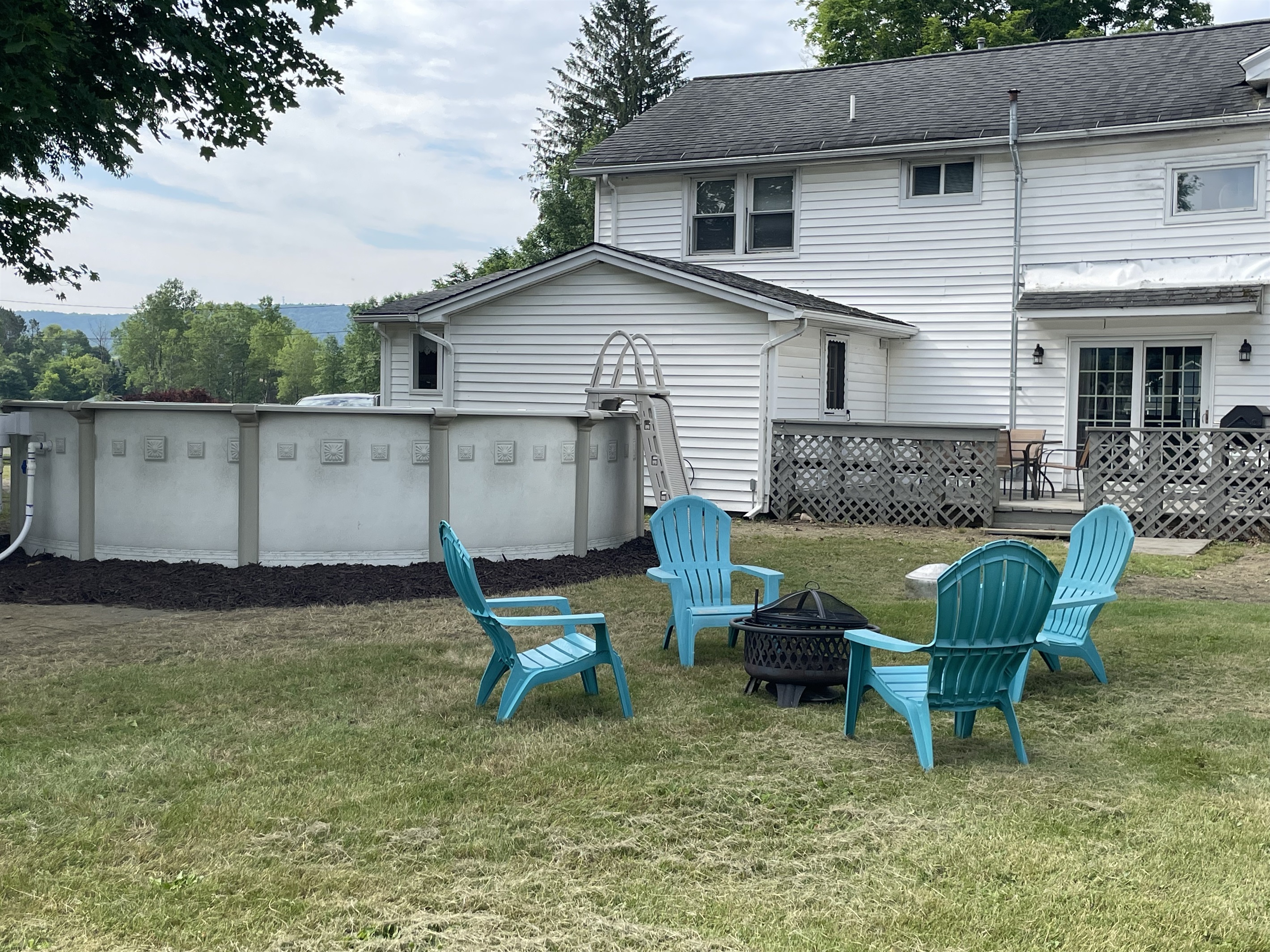Firepit and pool in backyard