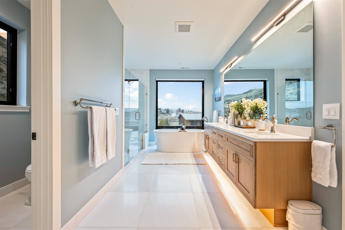 Bathroom #7 of 8 - Upstairs, ensuite to the primary bedroom with soaking tub, walk in shower, and lake views and access to the walk-in closet