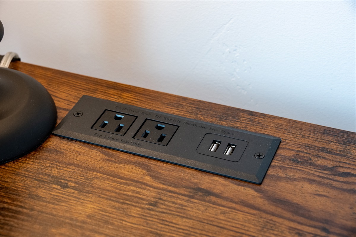 Nightstand outlets with USB—easy charging for devices.