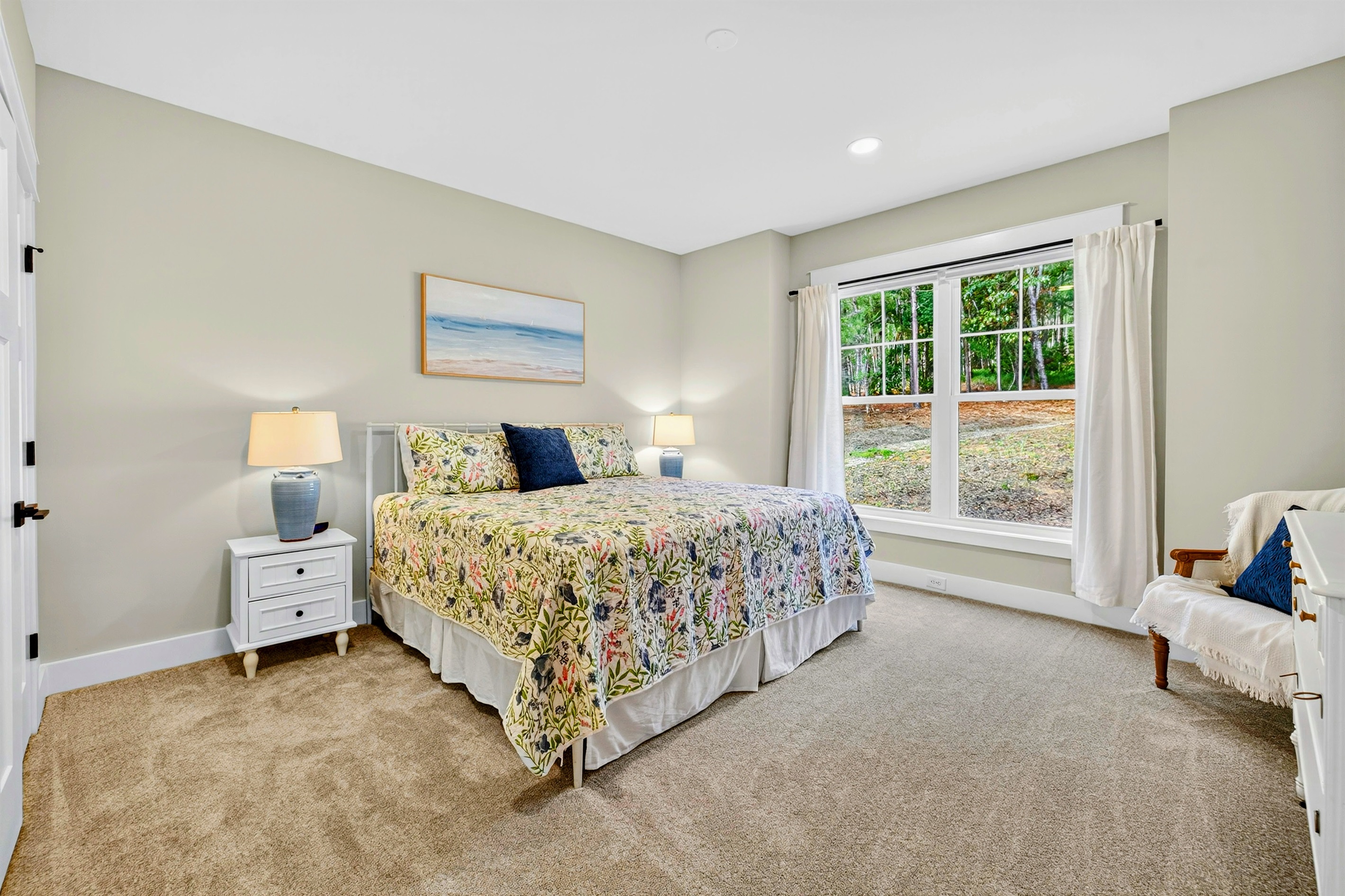 The 2nd main level king suite blends crisp, fun colors with bright, luxurious bedding and a stately antique dresser to add timeless charm to the suite. We also coordinated the same colors in this suite bath to create an inviting retreat.
