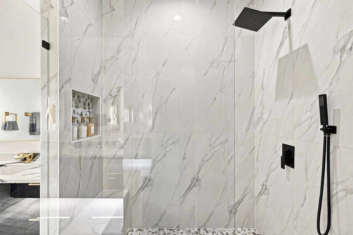 Experience modern elegance with a stunning rain shower and stylish finishes!
