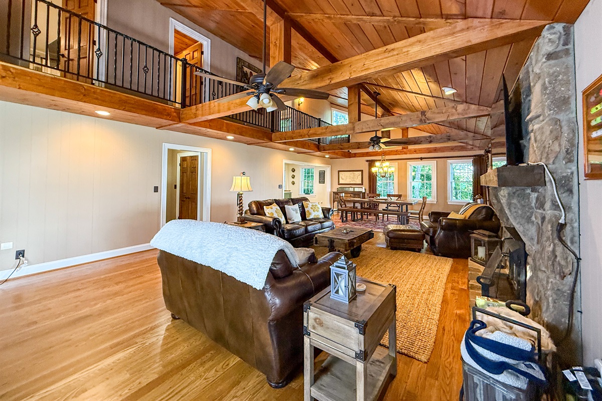 Upstairs, a balcony overlooks the living area, offering a charming overlook from the second-floor bedrooms.