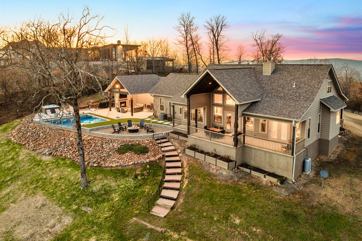 The stepped pathway leading to the house adds to the sense of arrival, guiding you into this elevated mountain escape.