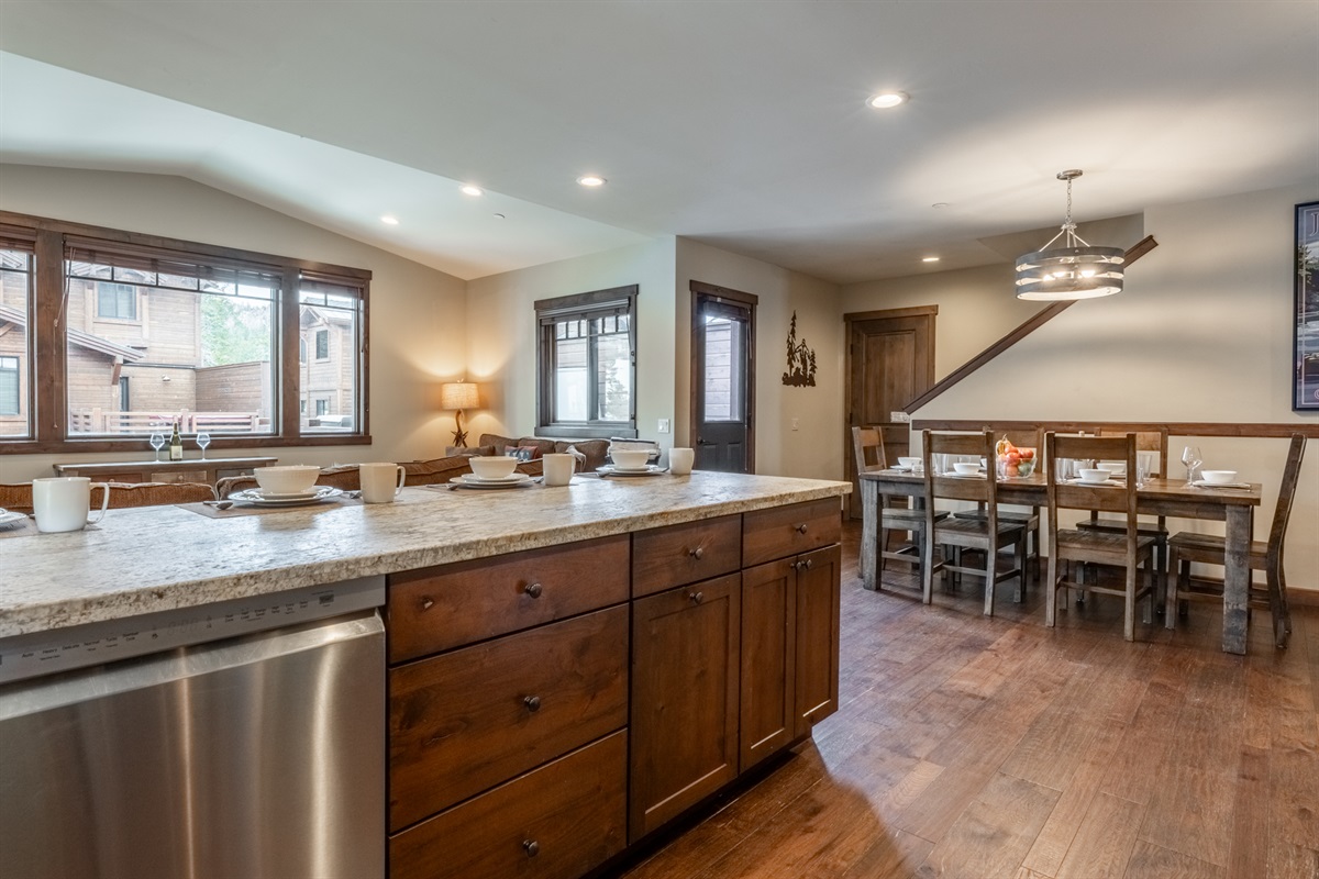 Designed for both ease and entertaining, the kitchen opens seamlessly to dining and living areas — ideal for everything from quick breakfasts to celebratory dinners.