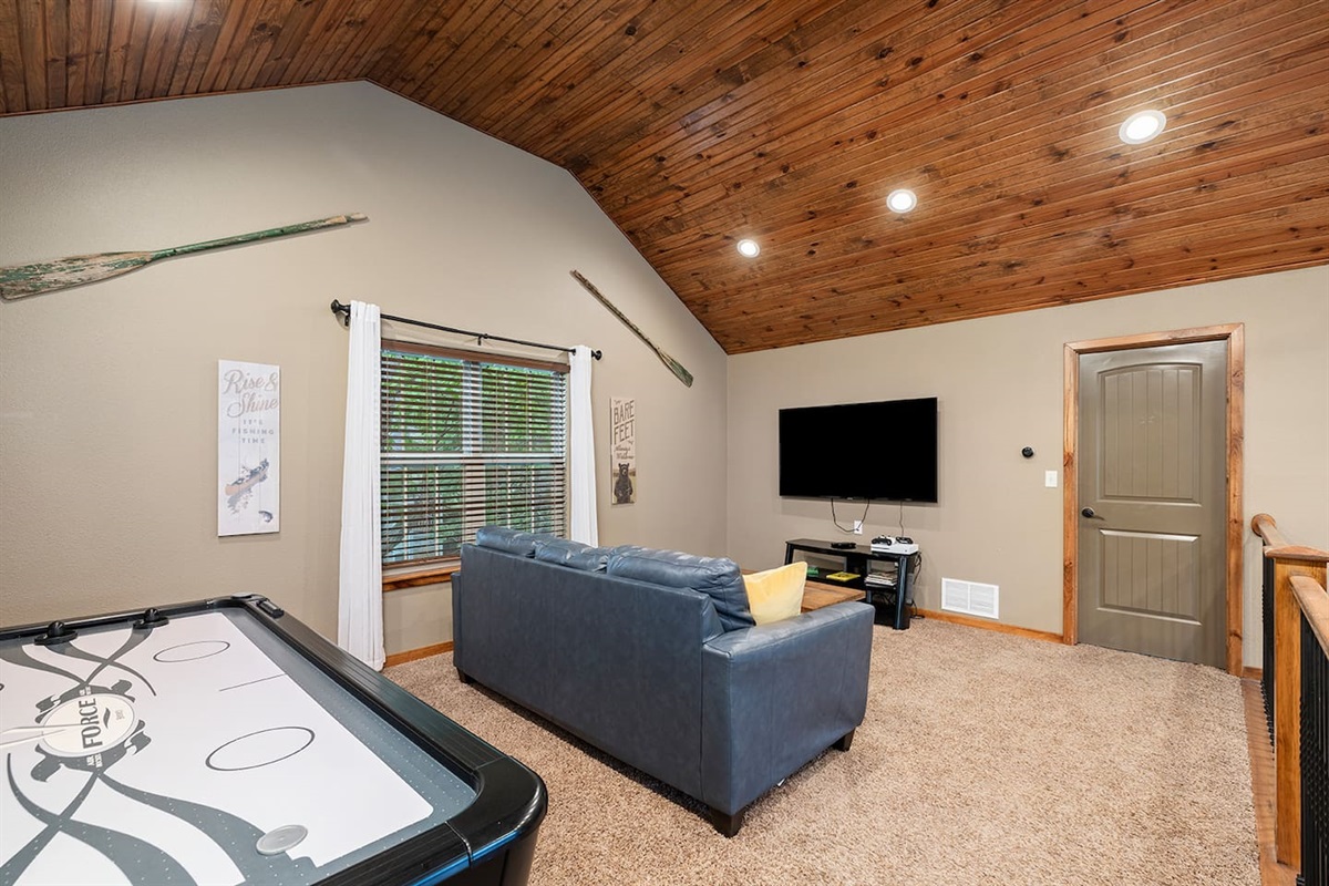 Upper level loft area with XBox, big screen tv, and air hockey