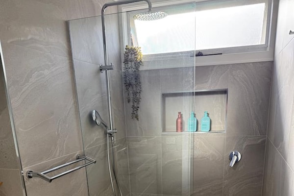 The smaller bathroom has a shower (2nd toilet) and single vanity. This one has central heating/cooling (the other one has a wall heater only). Also, fully stocked as you'd expect. Guests love the high-pressure shower.