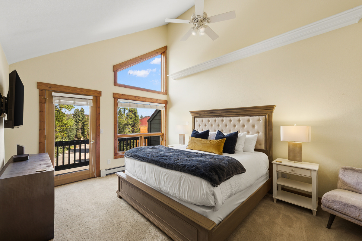 Primary/Master bedroom with King bed, private balcony and large TV