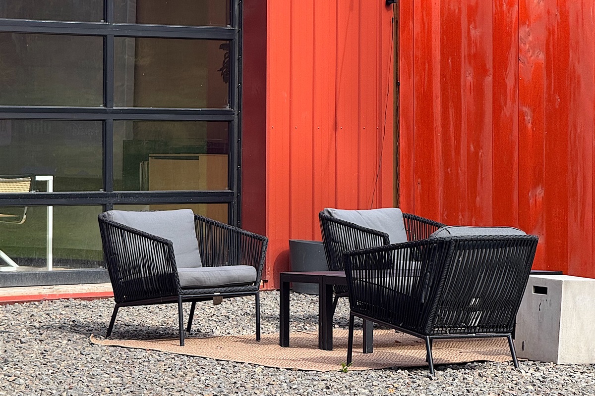 Exterior seating area with vintage Preway fireplace.