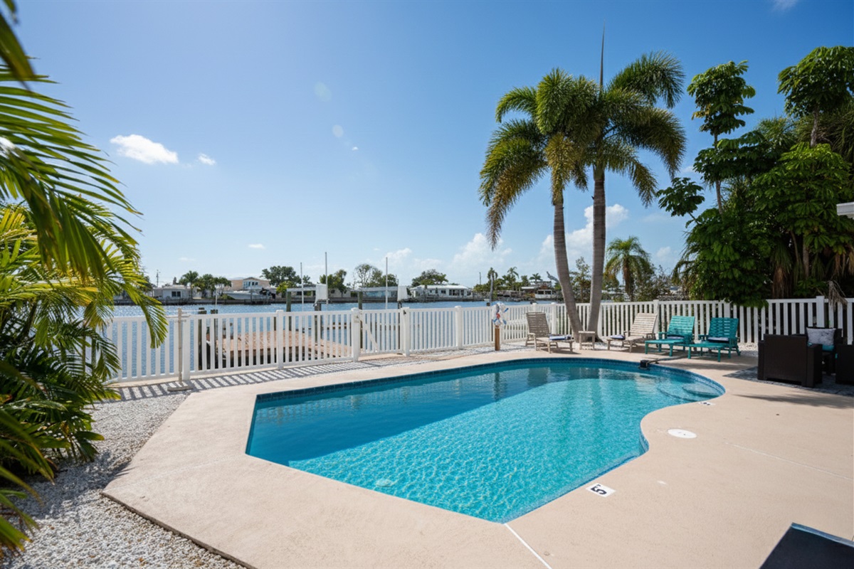 Treasure Cove's heated pool, loungers and grill call for guests to eat-in and relax pool and waterside.