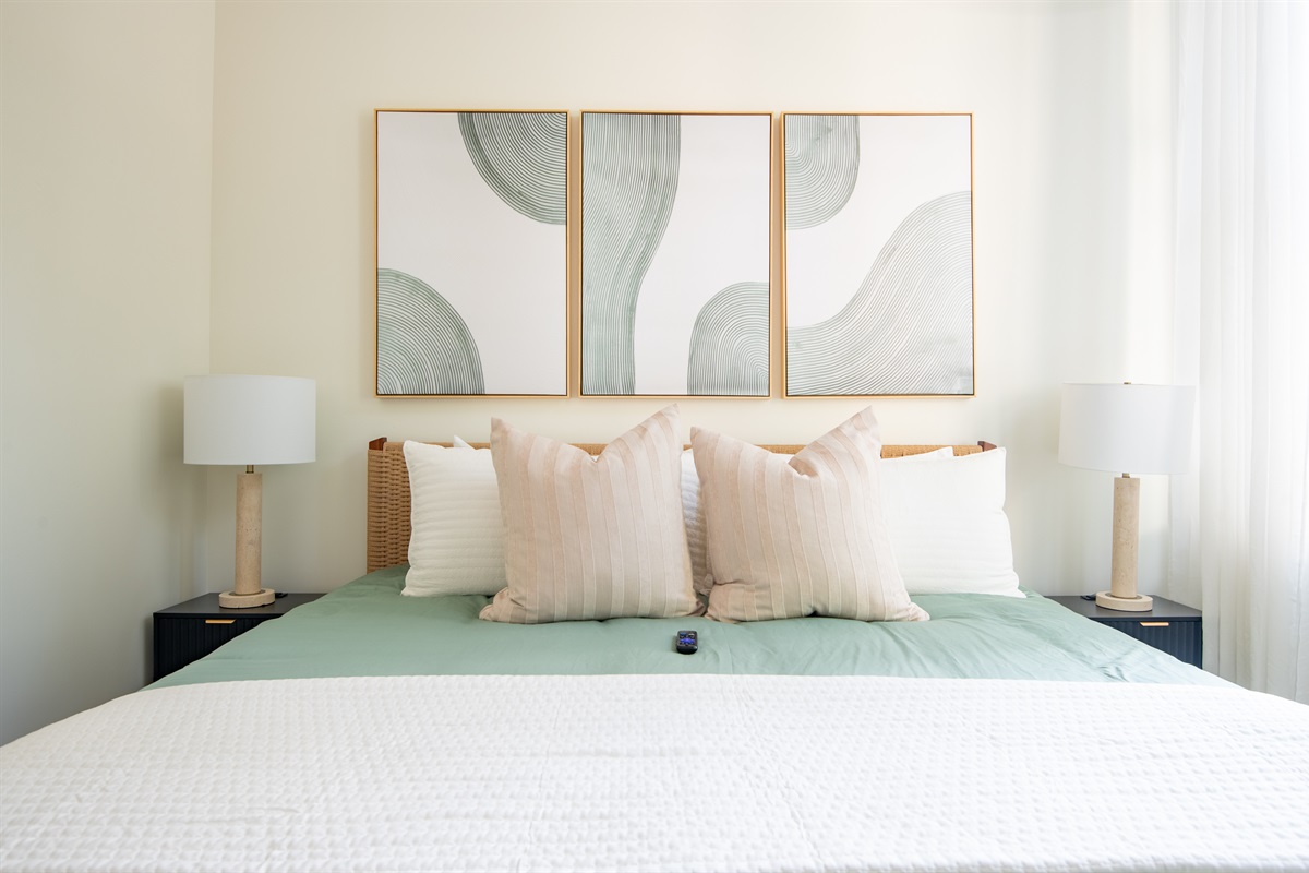 Bright bedroom with chic artwork and natural light