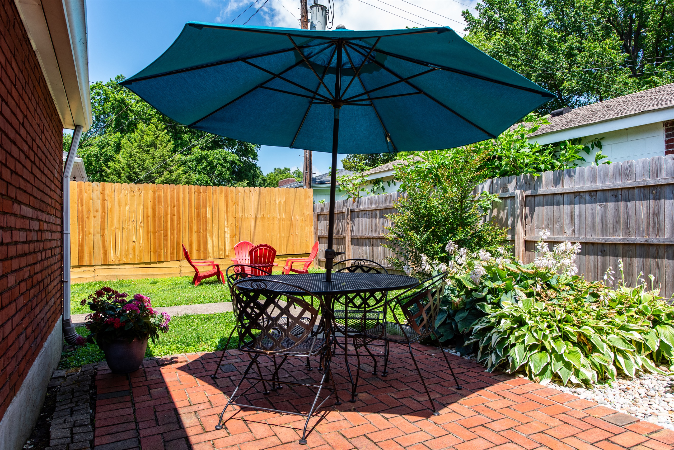 Enjoy a shaded outdoor dining area at this Louisville home on the Kentucky Bourbon Trail. Savor meals outside with a great bourbon  and cozy patio!  