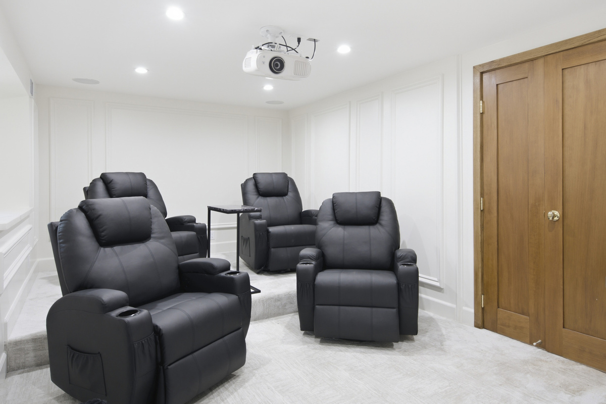Sit back, relax, and enjoy your favorite films in this beautiful home theater.