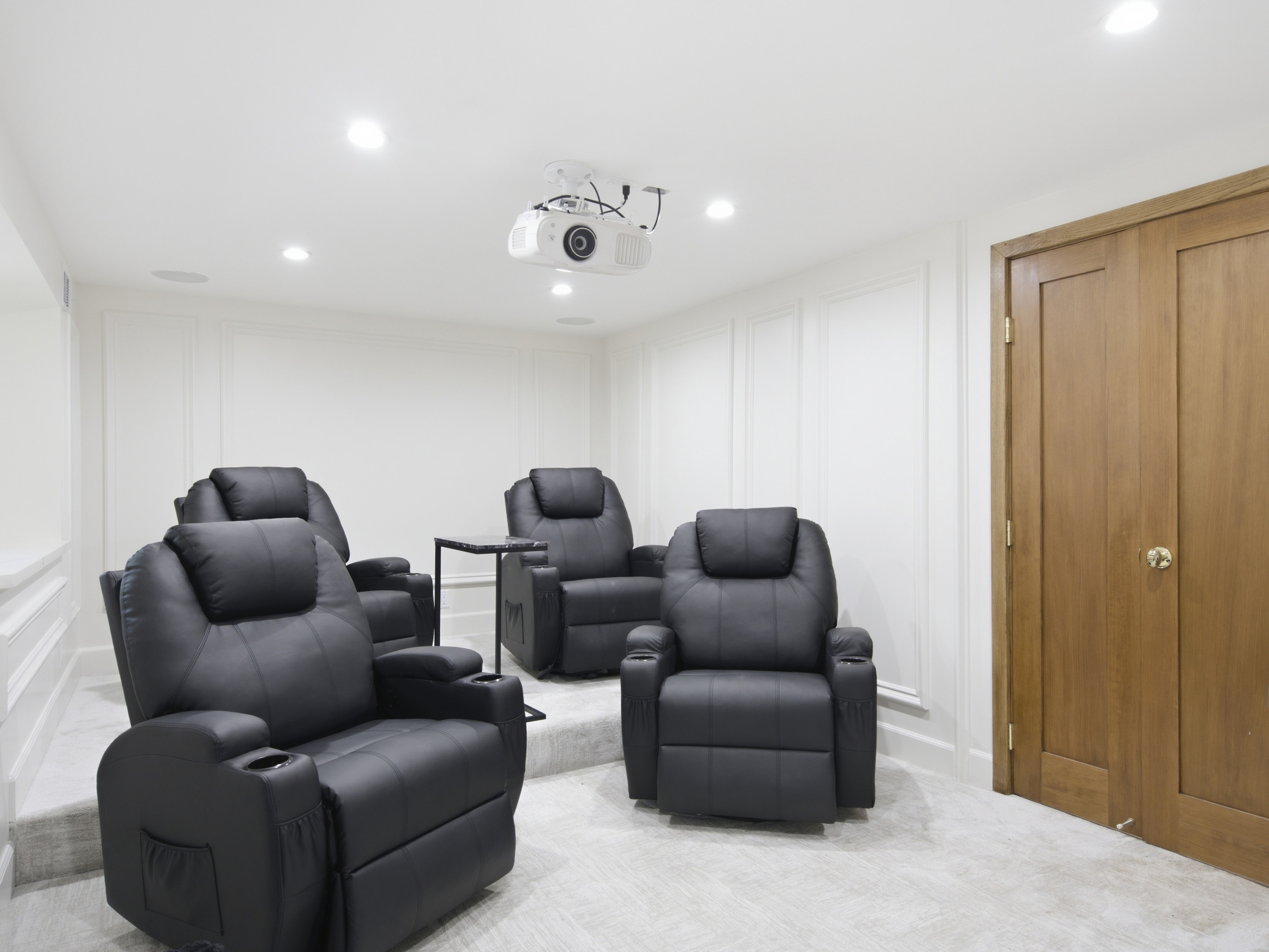 Sit back, relax, and enjoy your favorite films in this beautiful home theater.