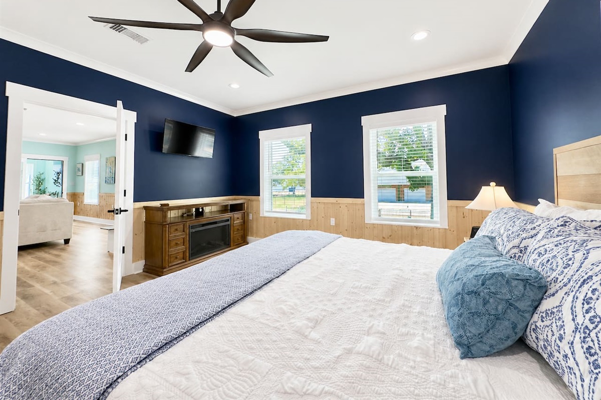 Rest easy in this bright space with cozy textures and charm.
