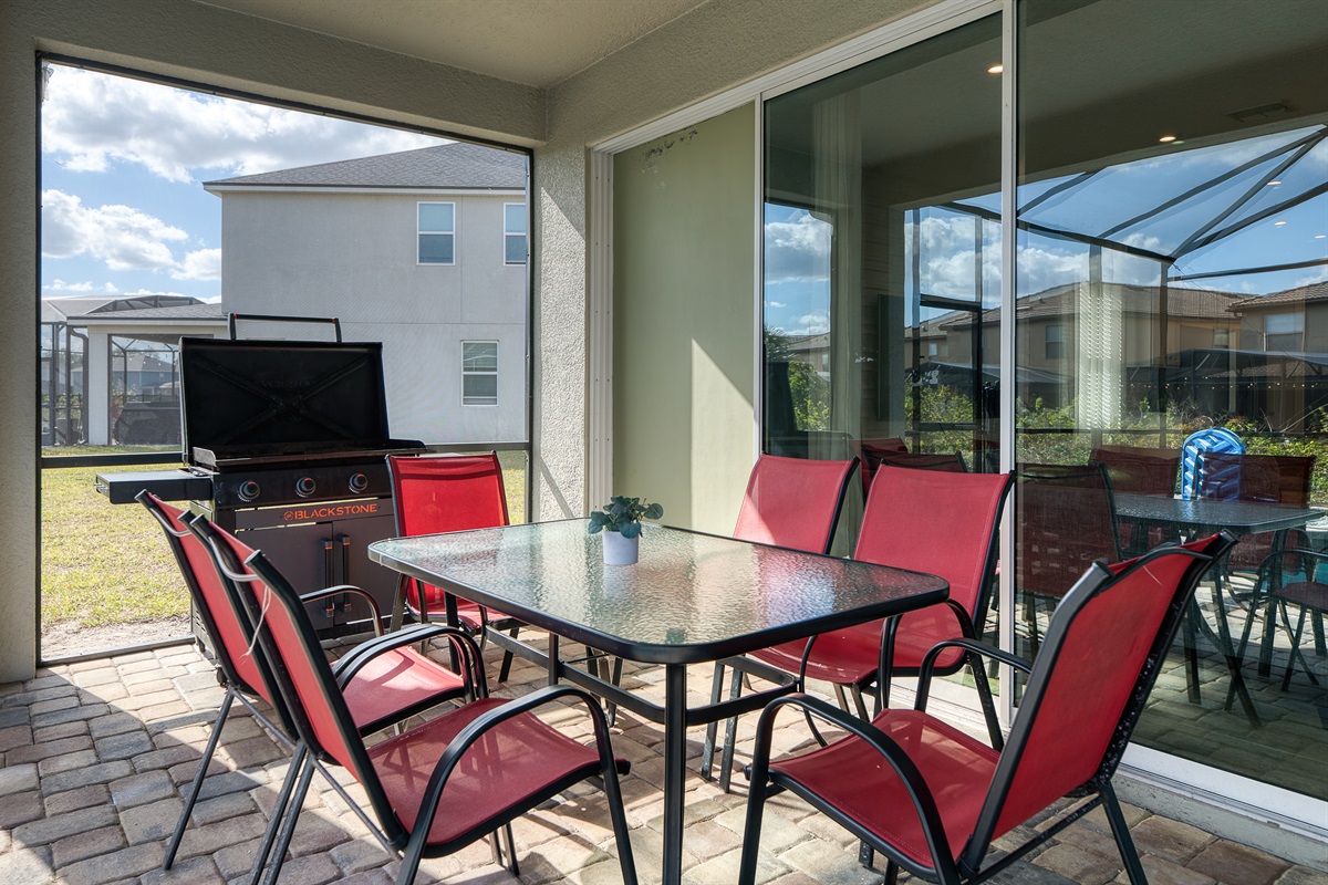 Outdoor Dining Oasis: Savor al fresco meals with a grill and spacious seating under sunny skies!