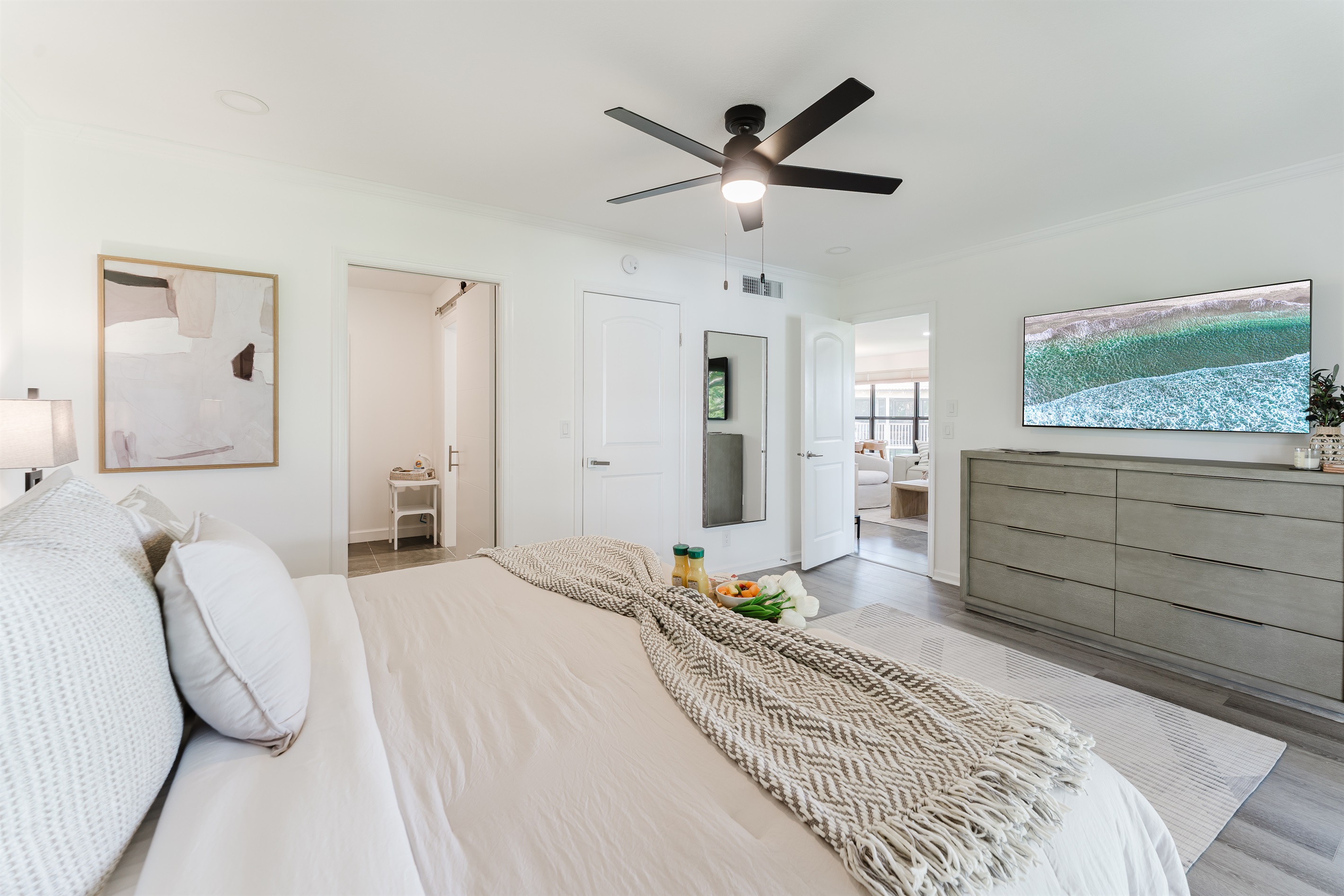 Spacious primary suite with a comfortable king bed and a serene atmosphere. Relaxing retreat designed for restful nights and peaceful mornings. Thoughtfully designed bedroom with hotel-quality comfort