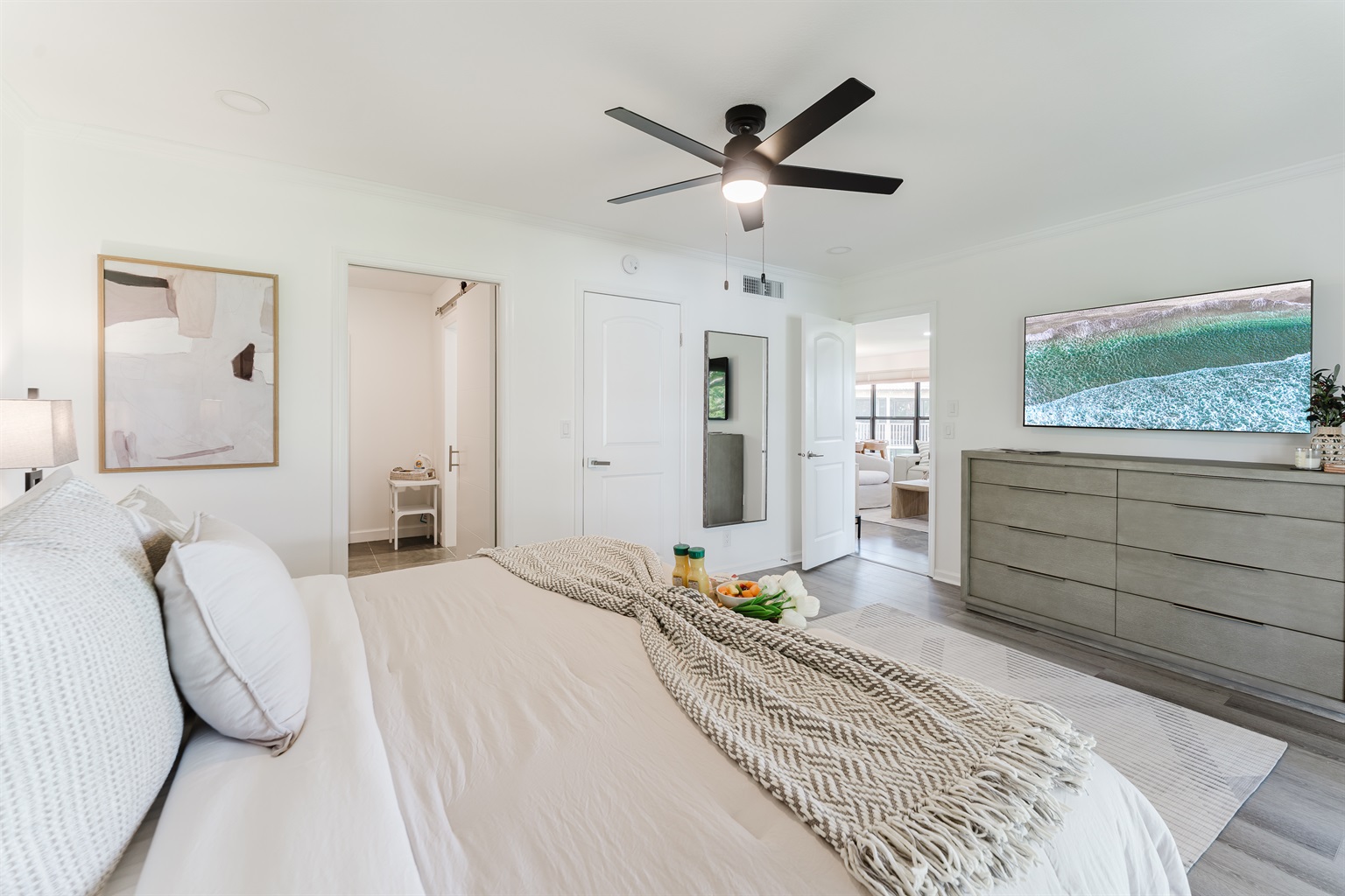 Spacious primary suite with a comfortable king bed and a serene atmosphere. Relaxing retreat designed for restful nights and peaceful mornings. Thoughtfully designed bedroom with hotel-quality comfort