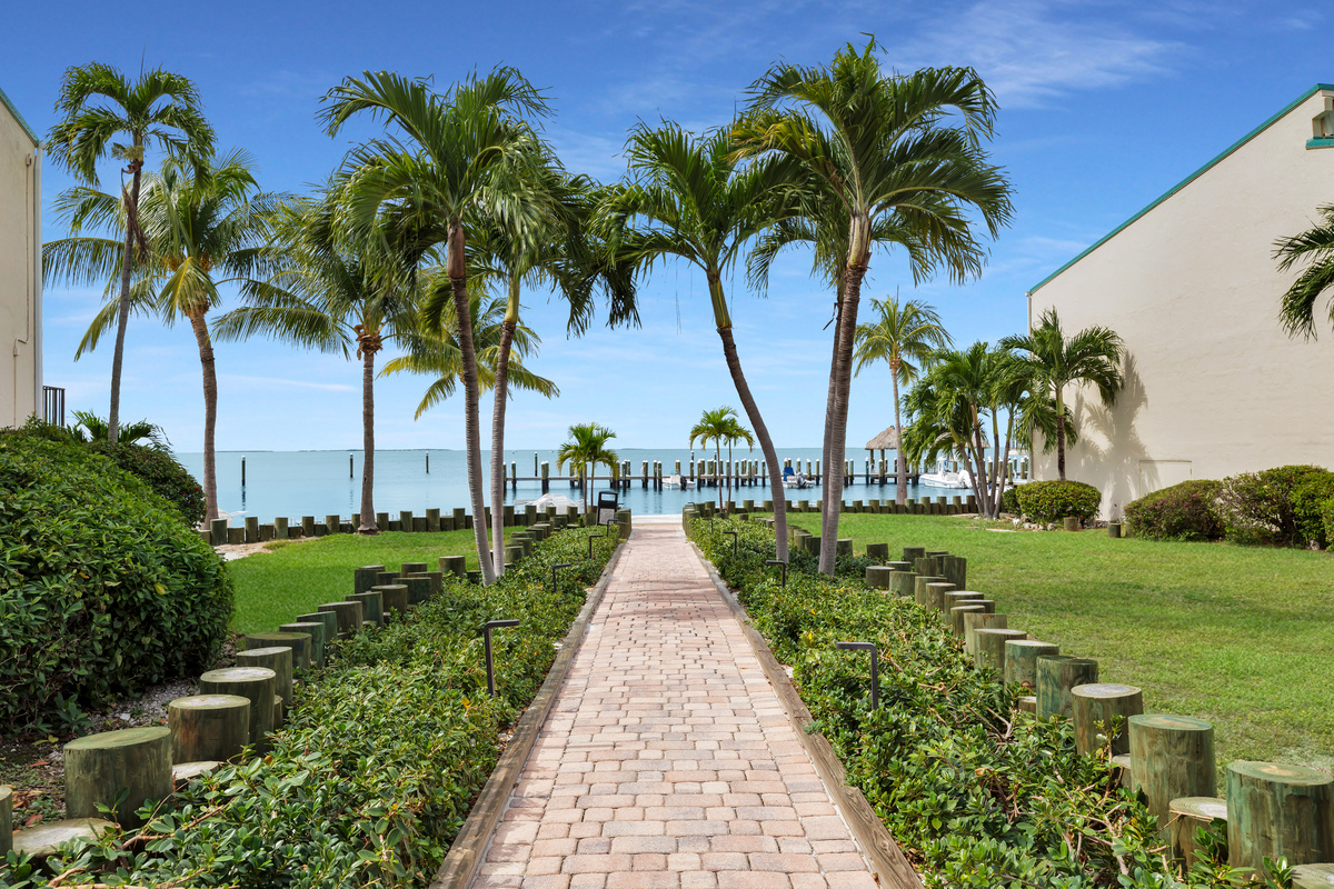 Pathway to sandy beach and docks