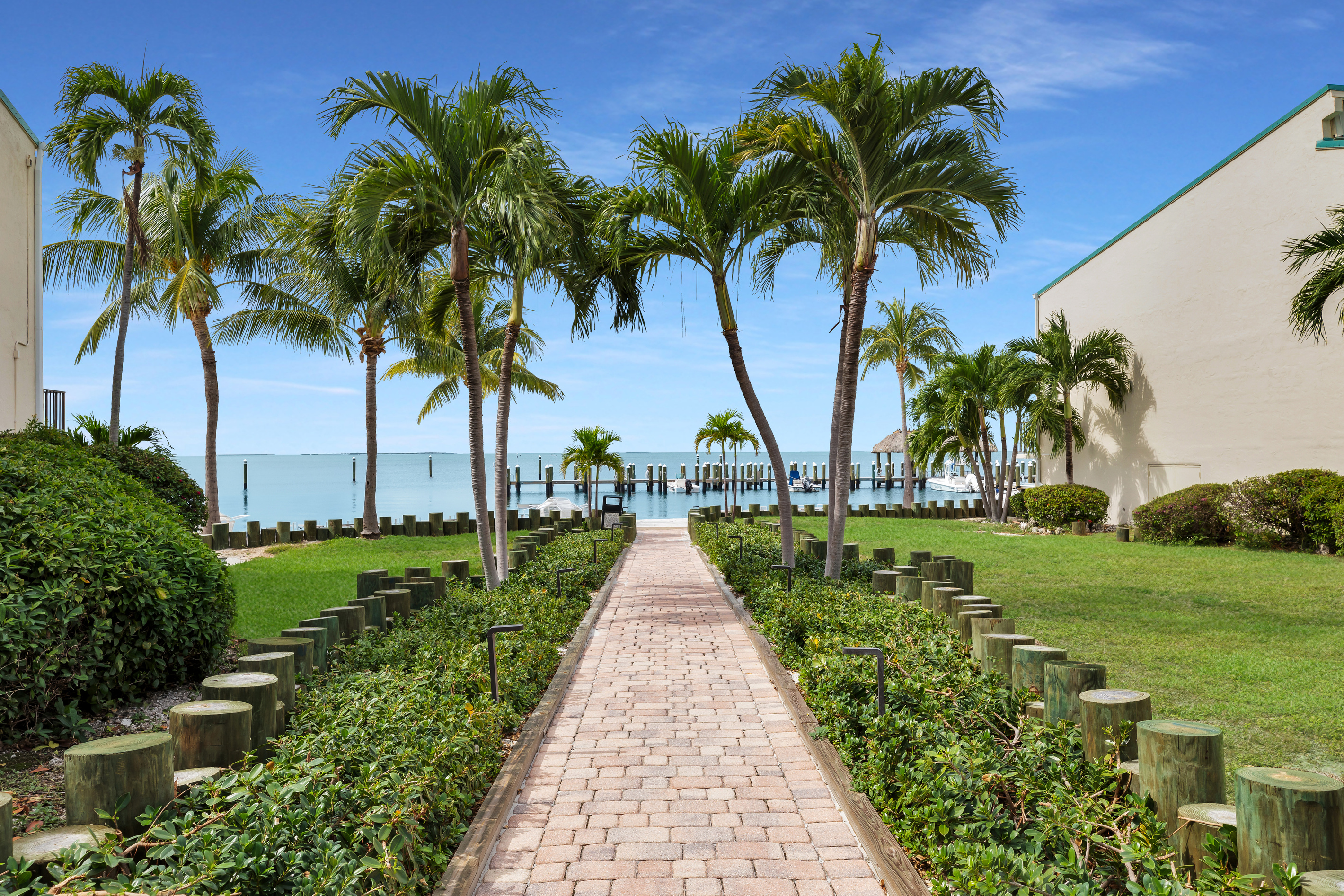 Pathway to sandy beach and docks