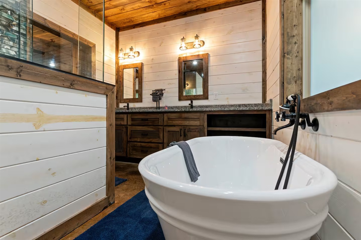 The primary ensuite offers a deep soaking tub that feels like your own spa sanctuary — perfect after a day on the lake or hiking the trails.