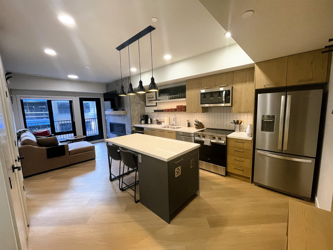 High end kitchen area, with granite counter tops. Stainless steel appliances include oversized fridge, glass-top range, stove, microwave, tea and coffee makers. Seating for four by the breakfast bar. Tastefully decorate with a mountain theme. 