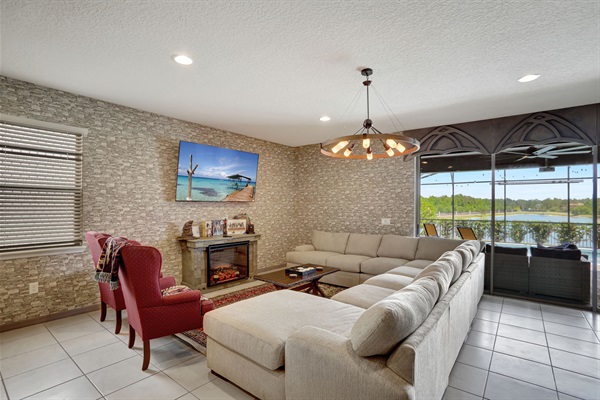 Living Room with large flat screen TV and fireplace.