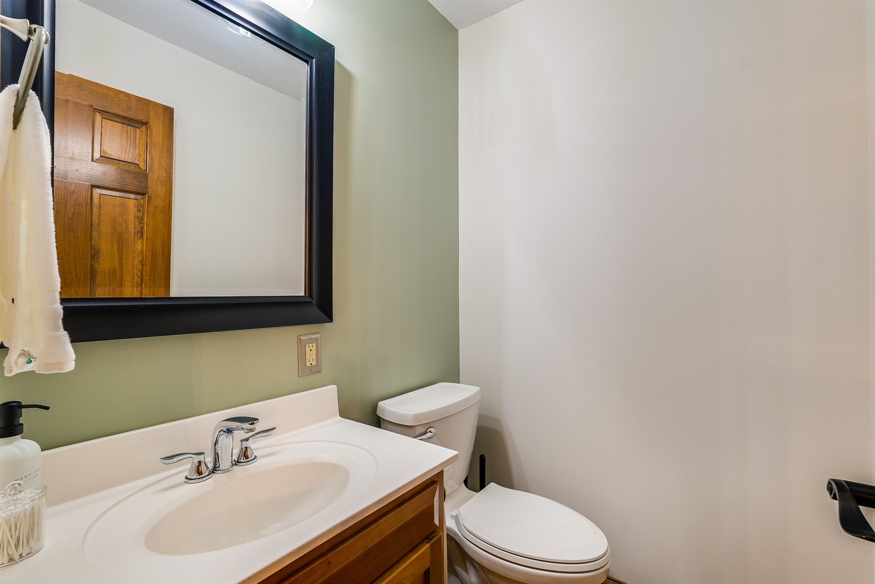 Convenient half bath on the main floor, easy access for all.