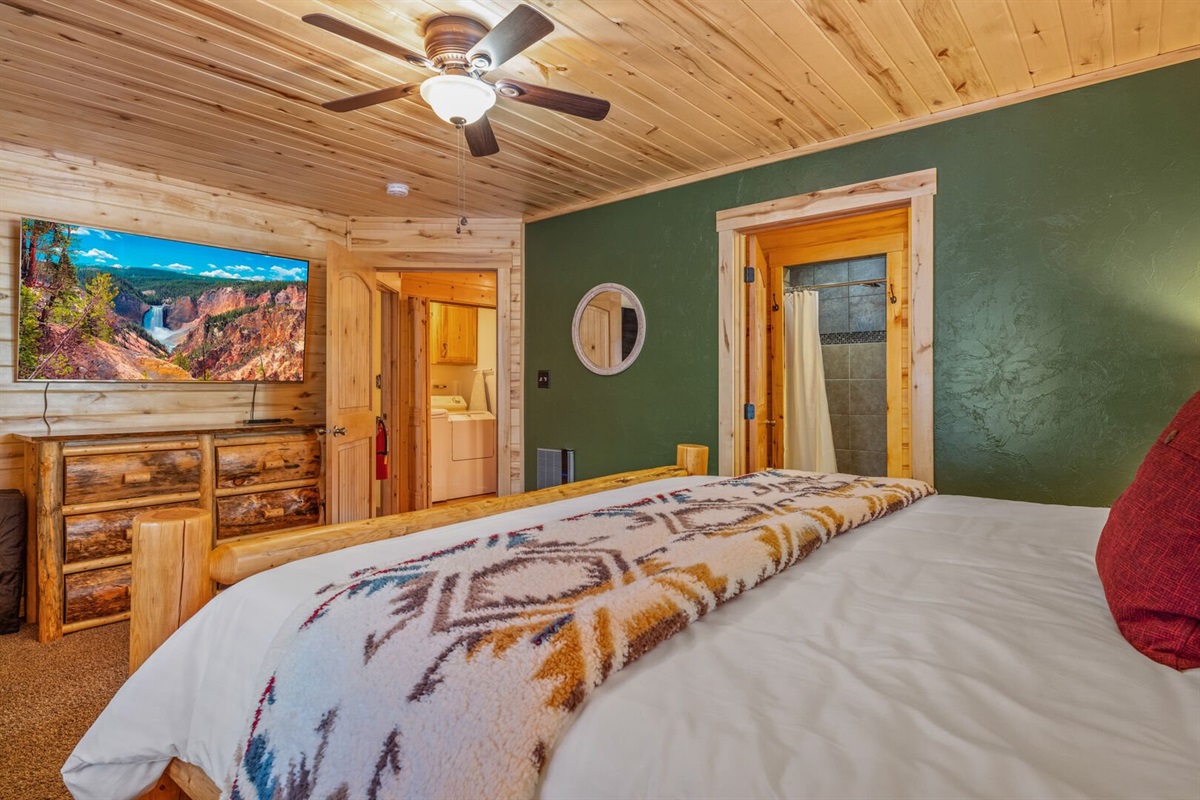 Master bedroom w/ king sized bed and private ensuite bathroom